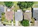 Aerial view showcases this well-maintained home, its roof, driveway, lawn, and neighboring properties at 13523 Prestwick Dr, Riverview, FL 33579