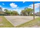 Community basketball and volleyball court with blue skies and fluffy white clouds overhead at 13523 Prestwick Dr, Riverview, FL 33579