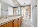 Neutral bathroom featuring a wide vanity, large mirror, and tub/shower with a playful curtain at 13523 Prestwick Dr, Riverview, FL 33579