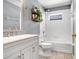 Bright bathroom with a white vanity, large mirror, and bathtub/shower combo with tiled walls at 13523 Prestwick Dr, Riverview, FL 33579