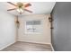 Clean bedroom with wood floors, a ceiling fan, and a neutral color scheme for a calming ambiance at 13523 Prestwick Dr, Riverview, FL 33579