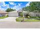 Attractive single-story home featuring a two-car garage and lovely, well-maintained landscaping at 13523 Prestwick Dr, Riverview, FL 33579