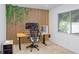 Bright office space with wood slat accent wall, natural light, and modern desk setup at 13523 Prestwick Dr, Riverview, FL 33579
