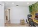 Bright office space with wood slat accent wall, natural light, and neutral carpet at 13523 Prestwick Dr, Riverview, FL 33579