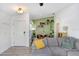 Cozy living room with decorative shelves, comfortable gray sofa, and stylish flooring at 13523 Prestwick Dr, Riverview, FL 33579