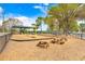 Community playground with picnic tables, and playground equipment under a bright blue sky at 13523 Prestwick Dr, Riverview, FL 33579