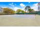 Well-maintained community tennis courts with green fencing and a beautiful blue sky at 13523 Prestwick Dr, Riverview, FL 33579