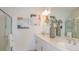 Bright bathroom featuring double sinks and modern fixtures at 13556 Tropical Breeze Way, Hudson, FL 34669