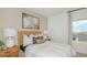 Well-lit bedroom boasting a cozy ambiance and scenic outdoor views at 13556 Tropical Breeze Way, Hudson, FL 34669