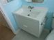 Chic bathroom featuring a modern floating vanity, chrome fixtures, and a retro-inspired penny tile floor at 138 36Th N Ave # 206W, St Petersburg, FL 33704