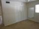Spacious bedroom with a large closet, neutral carpet, and ample natural light, ready for personalization at 138 36Th N Ave # 206W, St Petersburg, FL 33704