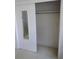 Walk-in closet featuring sliding doors, clothing rod, and plenty of storage space at 138 36Th N Ave # 206W, St Petersburg, FL 33704