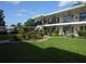 Charming two-story condo complex with iron railings and landscaped courtyard at 138 36Th N Ave # 206W, St Petersburg, FL 33704