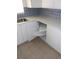 Efficient kitchen design featuring rotating corner shelves, white cabinets, modern countertops, and stylish backsplash at 138 36Th N Ave # 206W, St Petersburg, FL 33704
