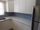 Bright, galley kitchen with updated cabinetry and stainless steel appliances at 138 36Th N Ave # 206W, St Petersburg, FL 33704