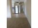 Inviting living area showcasing carpet flooring adjacent to an updated kitchen with stainless steel appliances at 138 36Th N Ave # 206W, St Petersburg, FL 33704