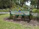 Northeast Exchange Club Coffee Pot Park sign, City of St. Petersburg, in a green and wooded area at 138 36Th N Ave # 206W, St Petersburg, FL 33704