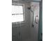 Updated shower with a glass door, adjustable shower head, grab bar, and easy-to-clean subway tile at 138 36Th N Ave # 206W, St Petersburg, FL 33704