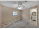 Vacant room with ceiling fan, and one window featuring walls painted in neutral color at 1472 Belcher S Rd, Largo, FL 33771