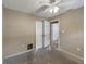 Empty room with bi-fold closet and entrance featuring walls painted in neutral color at 1472 Belcher S Rd, Largo, FL 33771