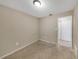 A simple bedroom with neutral walls and ceiling fixture at 1472 Belcher S Rd, Largo, FL 33771