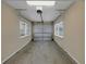 The garage features a motorized door, and windows at 1472 Belcher S Rd, Largo, FL 33771