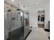 Sleek bathroom showcasing a glass-enclosed shower with multiple showerheads and modern fixtures at 16115 Mount Holly Dr, Bradenton, FL 34211