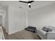 Bright bedroom featuring a closet and a chair with pillows to create a simple aesthetic at 16115 Mount Holly Dr, Bradenton, FL 34211