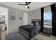 Modern bedroom with stylish decor, a ceiling fan and comfortable furnishings at 16115 Mount Holly Dr, Bradenton, FL 34211