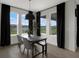 Bright dining area features large windows with a view, perfect for Gathering meals and entertaining at 16115 Mount Holly Dr, Bradenton, FL 34211