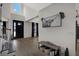 Spacious foyer featuring high ceilings, wood floors, and modern decorative touches at 16115 Mount Holly Dr, Bradenton, FL 34211