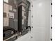 Lennox HVAC system in a home utility closet with white trim and a white door at 16115 Mount Holly Dr, Bradenton, FL 34211