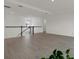 Bright, airy living room featuring sleek floors and contemporary railing at 16115 Mount Holly Dr, Bradenton, FL 34211