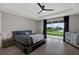 Serene main bedroom features a backyard view, stylish bedding, and a soothing, well-lit ambiance at 16115 Mount Holly Dr, Bradenton, FL 34211