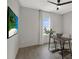 Modern office space with minimalist decor, featuring a sleek desk, chair, and a large window at 16115 Mount Holly Dr, Bradenton, FL 34211