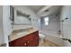 Bright bathroom with granite countertops, decorative mirror, and bathtub/shower combo at 1701 Hibiscus S Cir, Oldsmar, FL 34677