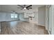 Inviting living room featuring a breakfast bar and direct access to the kitchen and dining area at 1701 Hibiscus S Cir, Oldsmar, FL 34677