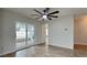 Bright living room with sliding glass doors leading to a screened lanai and beautiful backyard views at 1701 Hibiscus S Cir, Oldsmar, FL 34677