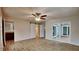 Spacious main bedroom with wood-look floors, sliding barn door to closet, and private bath at 1701 Hibiscus S Cir, Oldsmar, FL 34677