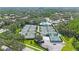 Aerial view of the community tennis courts and pool and surrounding neighborhood at 17809 Sandpine Trace Way, Tampa, FL 33647
