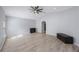 Bonus room with vaulted ceiling, wood-look flooring, and a ceiling fan at 17809 Sandpine Trace Way, Tampa, FL 33647