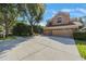 Charming two-story home with a three car garage and well-manicured landscaping at 17809 Sandpine Trace Way, Tampa, FL 33647