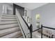 Bright foyer with high ceilings and a view of the staircase and front entrance at 17809 Sandpine Trace Way, Tampa, FL 33647
