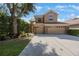 Charming two-story home with a large driveway and well-manicured landscaping at 17809 Sandpine Trace Way, Tampa, FL 33647