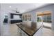 Open-concept kitchen with a large island, blue cabinets, and sliding glass doors to the outside patio at 17809 Sandpine Trace Way, Tampa, FL 33647
