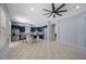 This large kitchen features modern appliances and an island with chairs for gathering with Gathering and friends at 17809 Sandpine Trace Way, Tampa, FL 33647