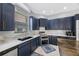 Modern kitchen with stainless steel appliances and sleek countertops for an upscale culinary experience at 17809 Sandpine Trace Way, Tampa, FL 33647