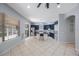 Open concept kitchen features stainless steel appliances, island with seating and sliding door to the outside at 17809 Sandpine Trace Way, Tampa, FL 33647