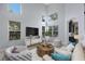 Bright living room with high ceilings, many windows, hardwood floors, and stylish furniture at 17809 Sandpine Trace Way, Tampa, FL 33647