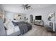Serene main bedroom with a king bed, stylish decor, and plenty of natural light at 17809 Sandpine Trace Way, Tampa, FL 33647